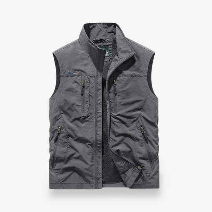Khaki men's multi-pocket vest jacket for summer outdoor activities. Lightweight, sleeveless, perfect for travel.
