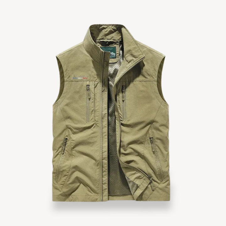 Breathable men's summer vest jacket with numerous practical pockets. Ideal lightweight layering for outdoor travel.