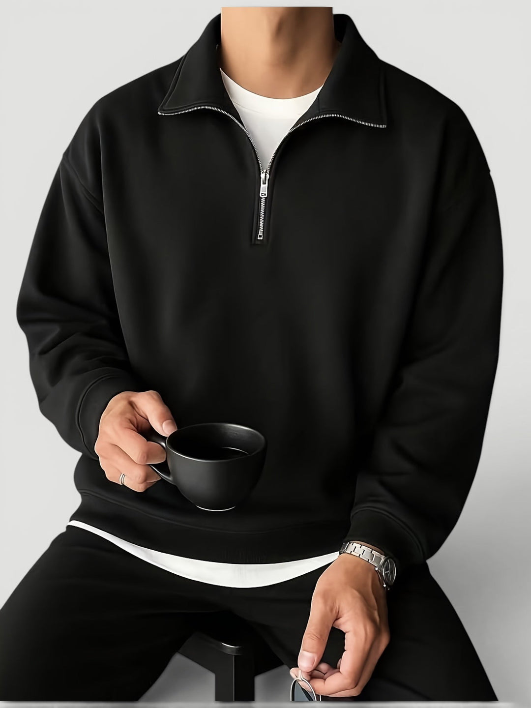 Modern men's quarter zip sweater with long sleeves, ideal for versatile lightweight layering.