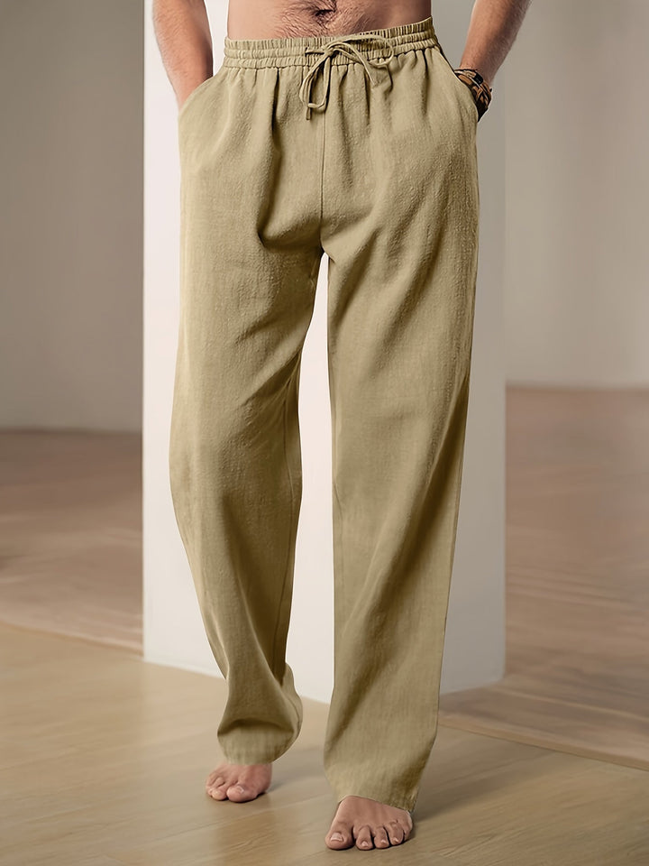 Men's relaxed fit joggers with drawstring waist. Lightweight comfort pants for lounging or casual wear.