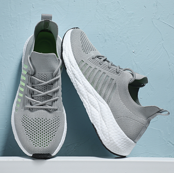 Side view of men's lightweight running shoes in grey.