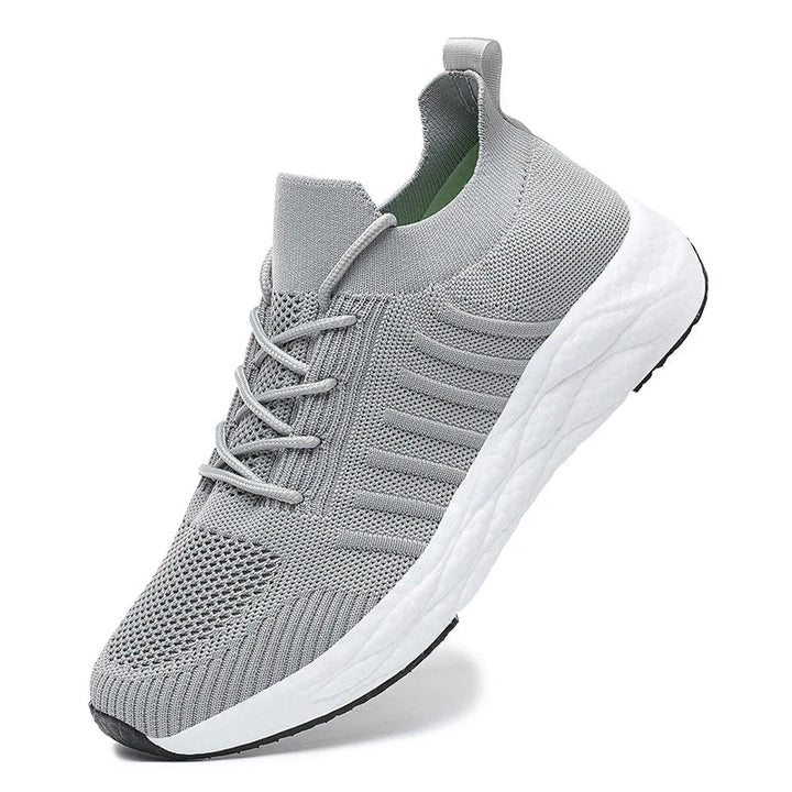 Dynamic shot of men's sport shoes in motion, highlighting lightweight design.