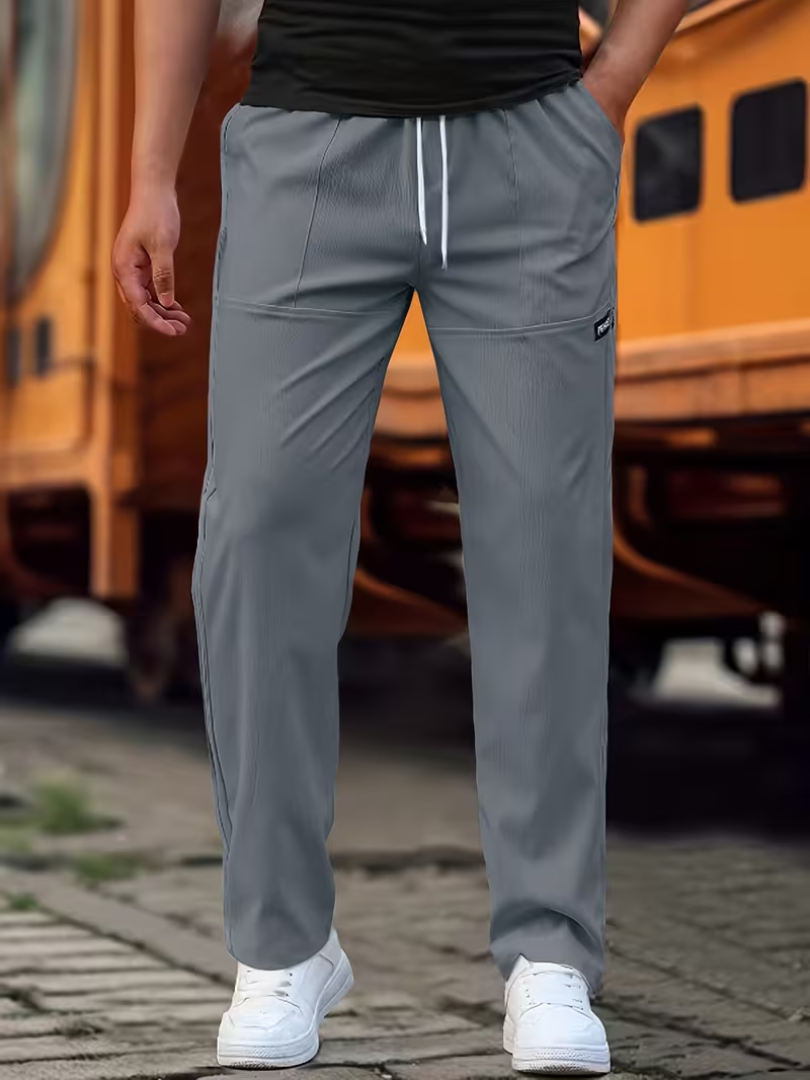 Relaxed fit men's essential straight-leg trousers, perfect for smart casual & seasonless wear.