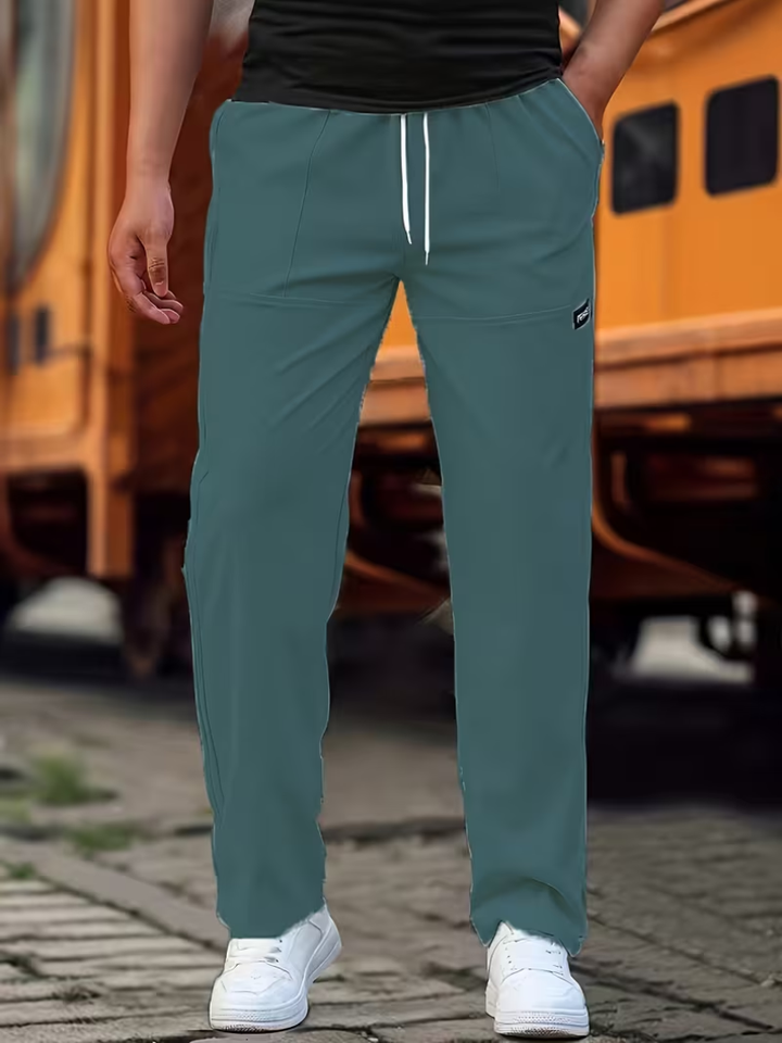 Modern men's straight-leg trousers in grey, offering comfort and versatility for casual wear.