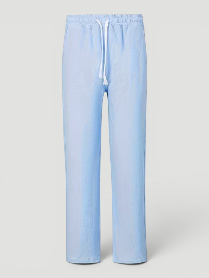 Close-up of pocket detail on men's lightweight straight leg pants, stylish & practical design.