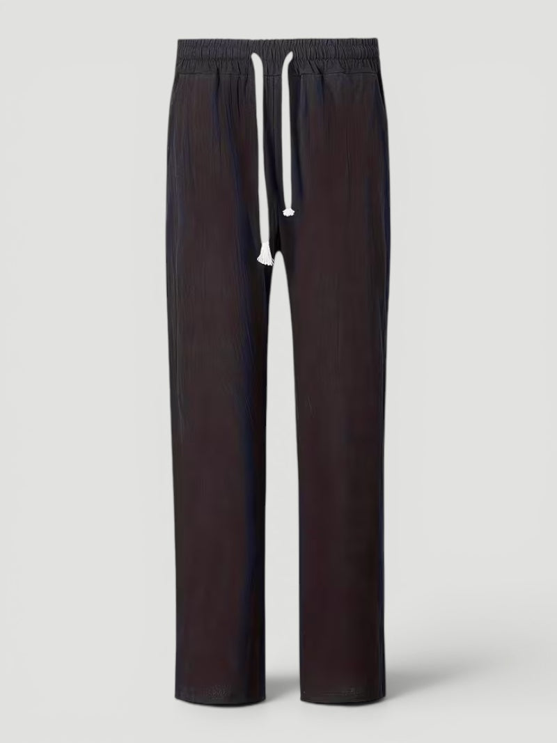Folded men's lightweight straight leg pants, ideal for versatile everyday wear & travel comfort.