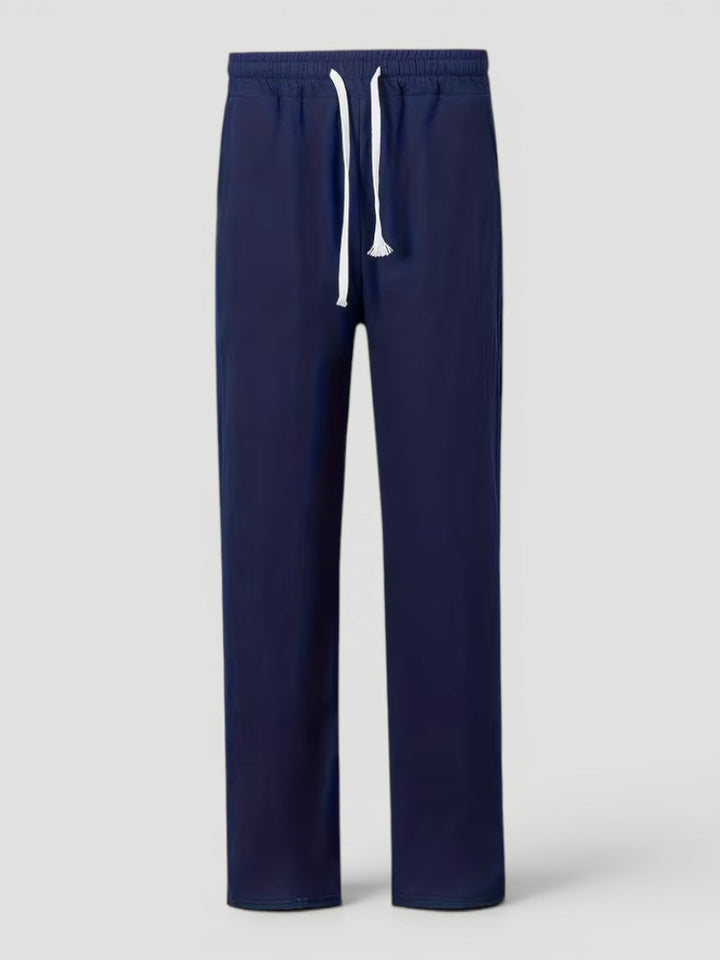 Man enjoying outdoor activity in comfortable lightweight straight leg casual trousers.