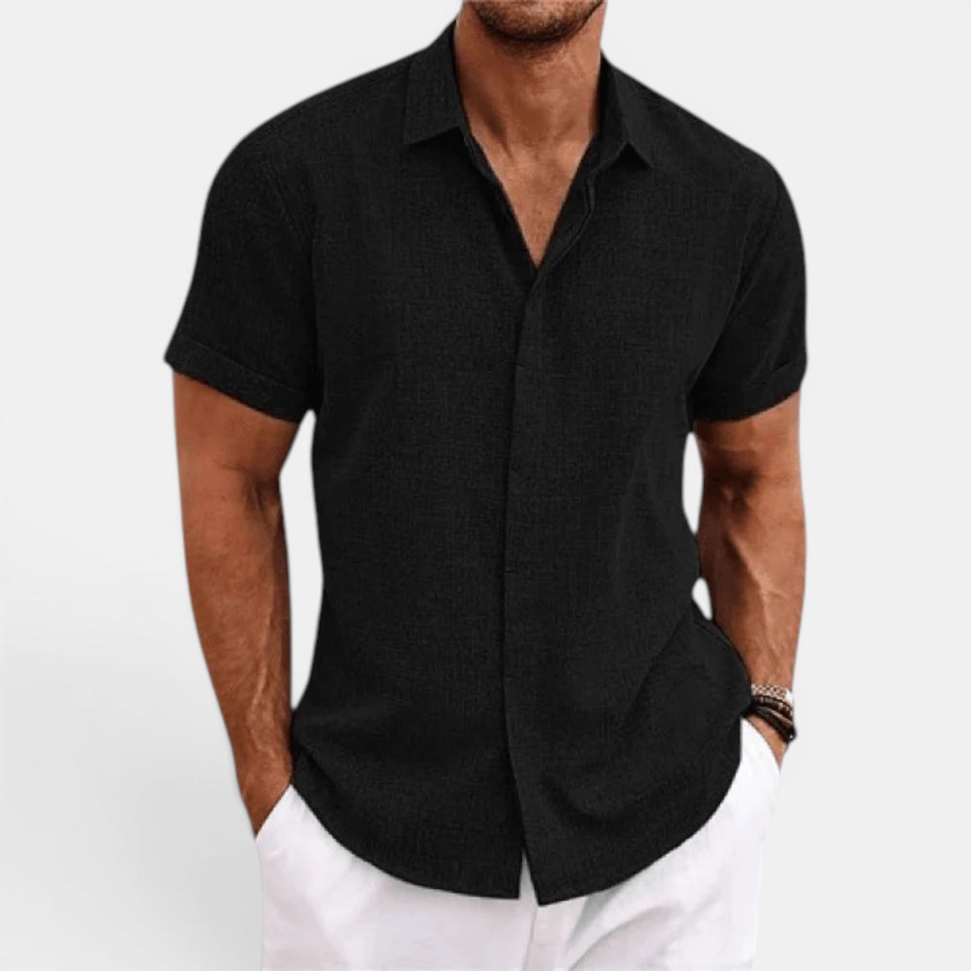Short sleeve men's summer shirt with button-up front. Lightweight casual top for warm weather timeless style.