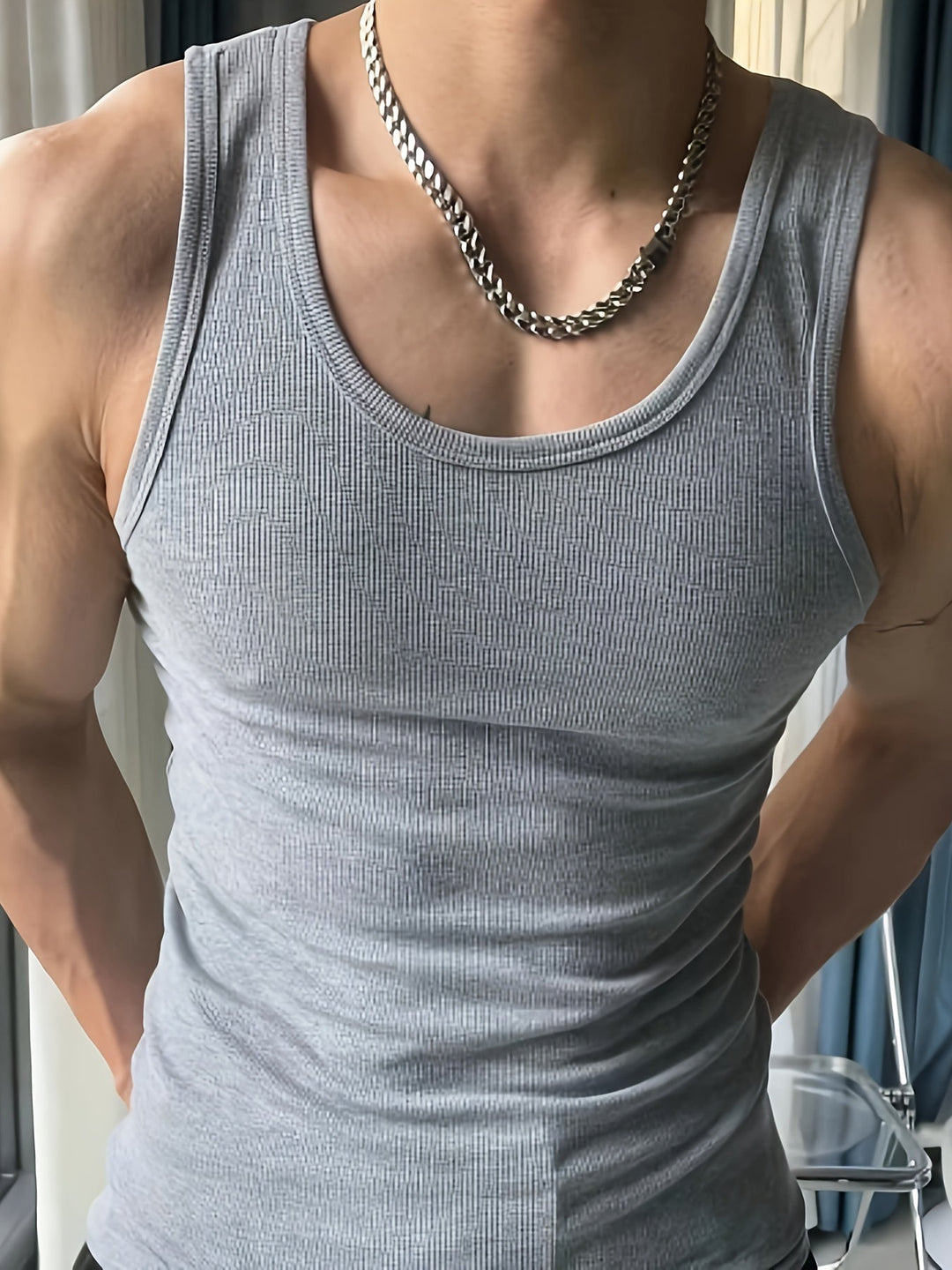 Athletic men's gym tank top, lightweight and sleeveless, ideal for ultimate comfort during workouts and fitness.