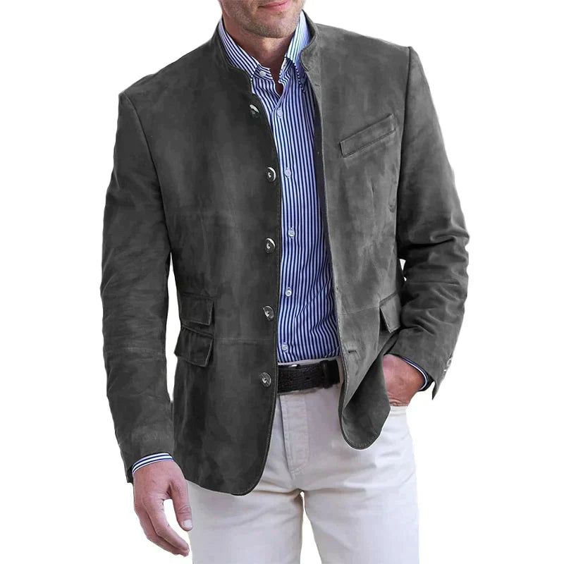 A man wearing a navy lightweight tailored fit blazer with a distinctive mandarin collar.