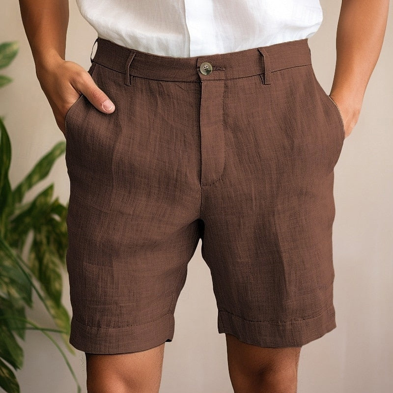 Men's comfortable green chino shorts with practical pockets, great for casual summer outings & warm weather.