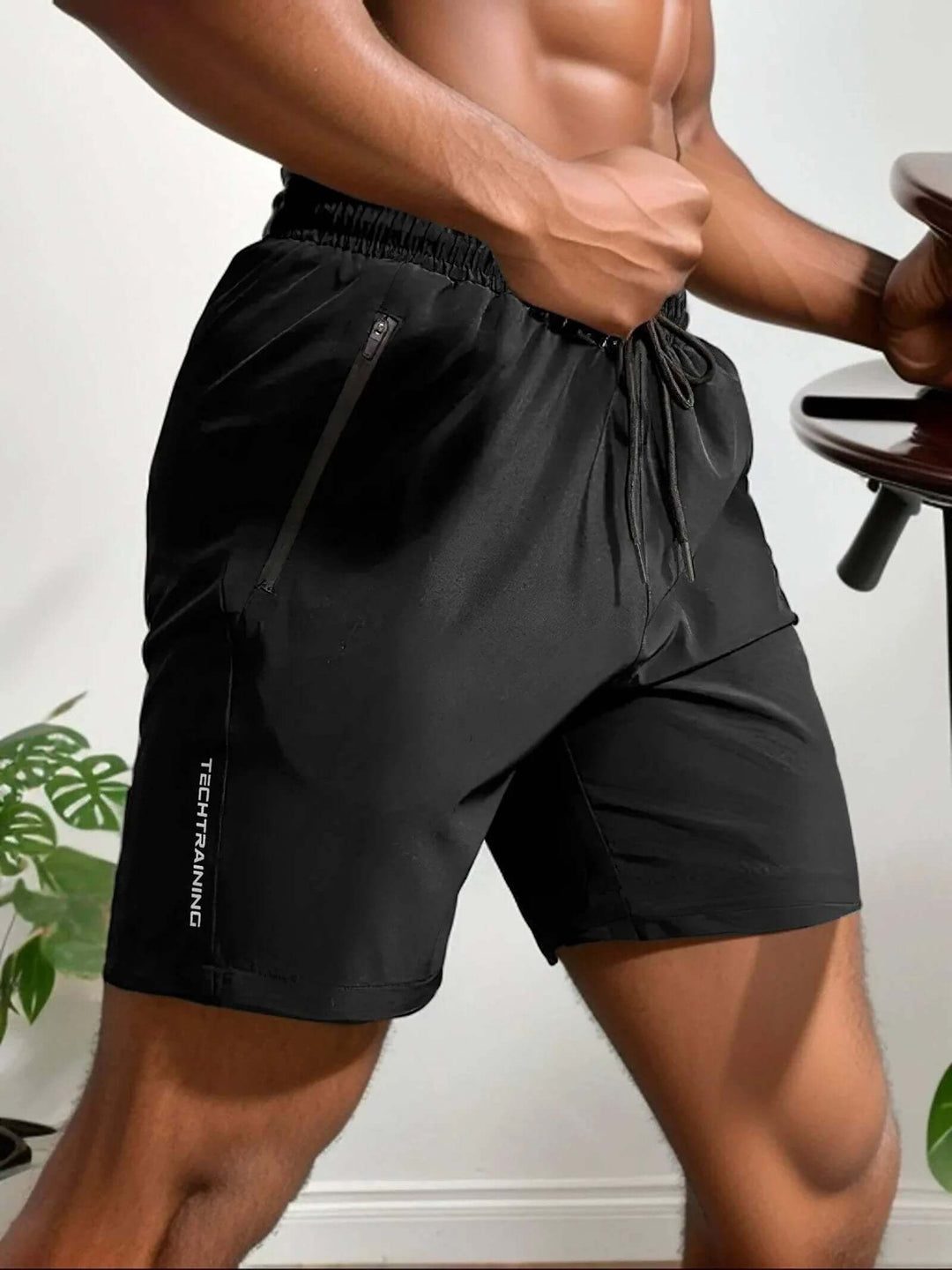 Men's lightweight training shorts with a secure zip pocket, ideal for gym workouts & running.