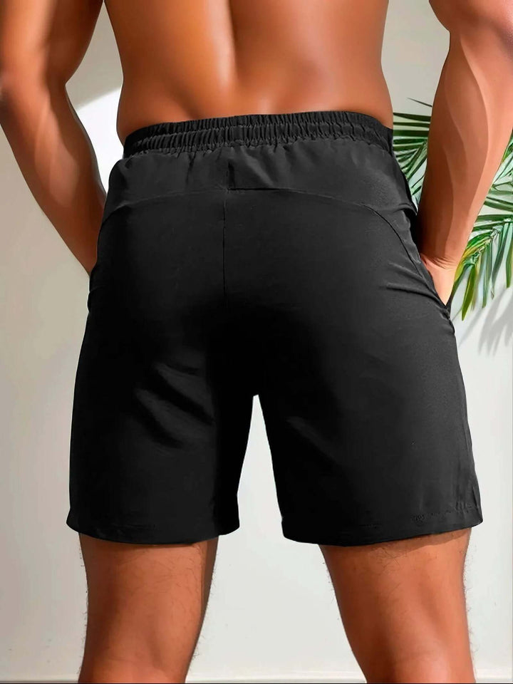 Performance men's running shorts, lightweight fabric & secure zip pocket for active workouts.