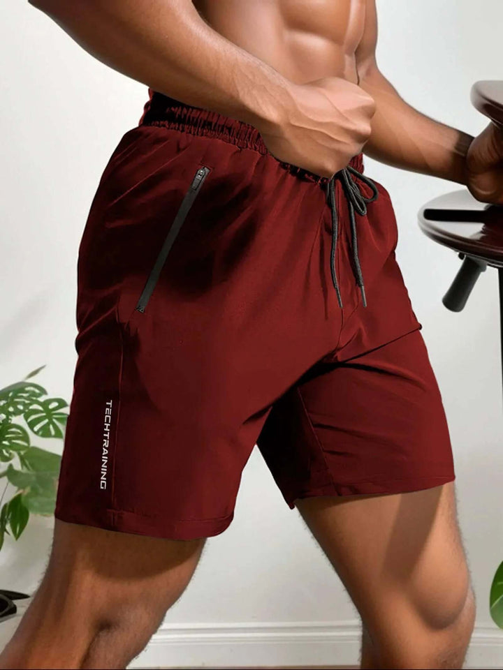 Durable men's training shorts, lightweight for running, gym, or active lifestyle, with zip pocket.
