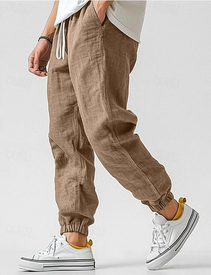Stylish men's linen joggers with a relaxed fit, ideal for breathable summer casual outfits.