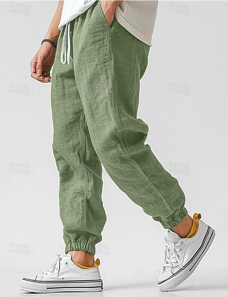 Comfortable men's relaxed fit linen trousers featuring an elastic waist & tapered leg.