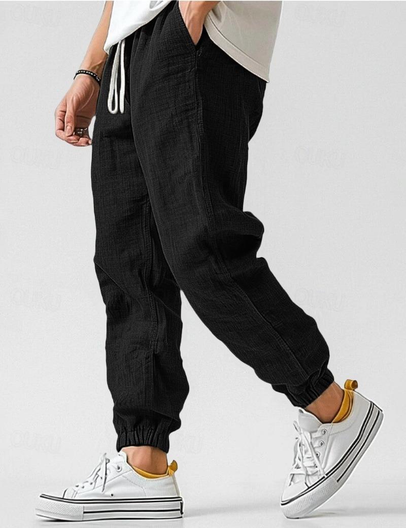 Tapered leg men's linen trousers, relaxed fit with elastic waist for breathable summer style.