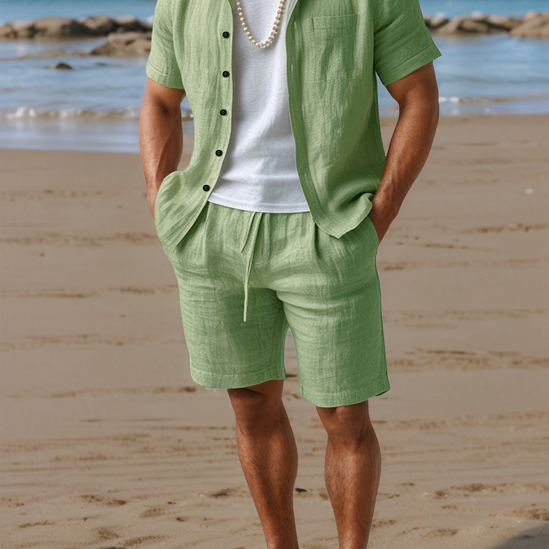 Short sleeve button-up shirt and elastic waist shorts for men.