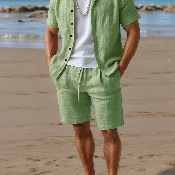 Short sleeve button-up shirt and elastic waist shorts for men.