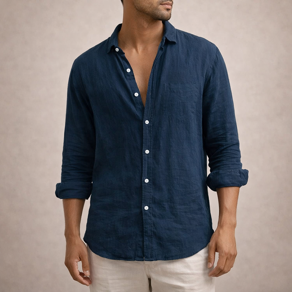 Detailed view of a men's long sleeve button-down shirt. Focus on the elegant spread collar & button details.
