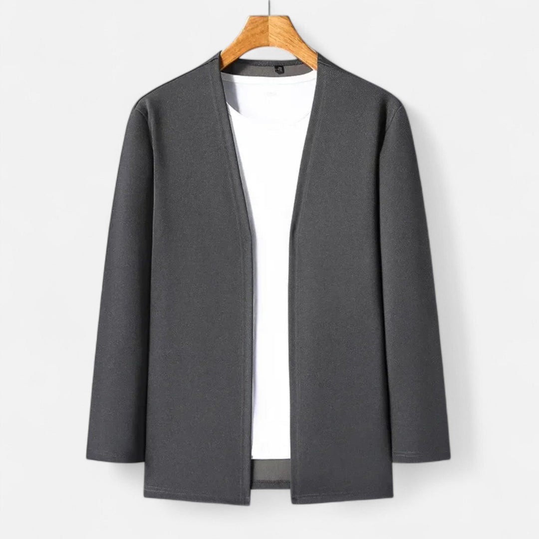 Versatile black long-sleeve cardigan cloak styled for casual fall fashion.