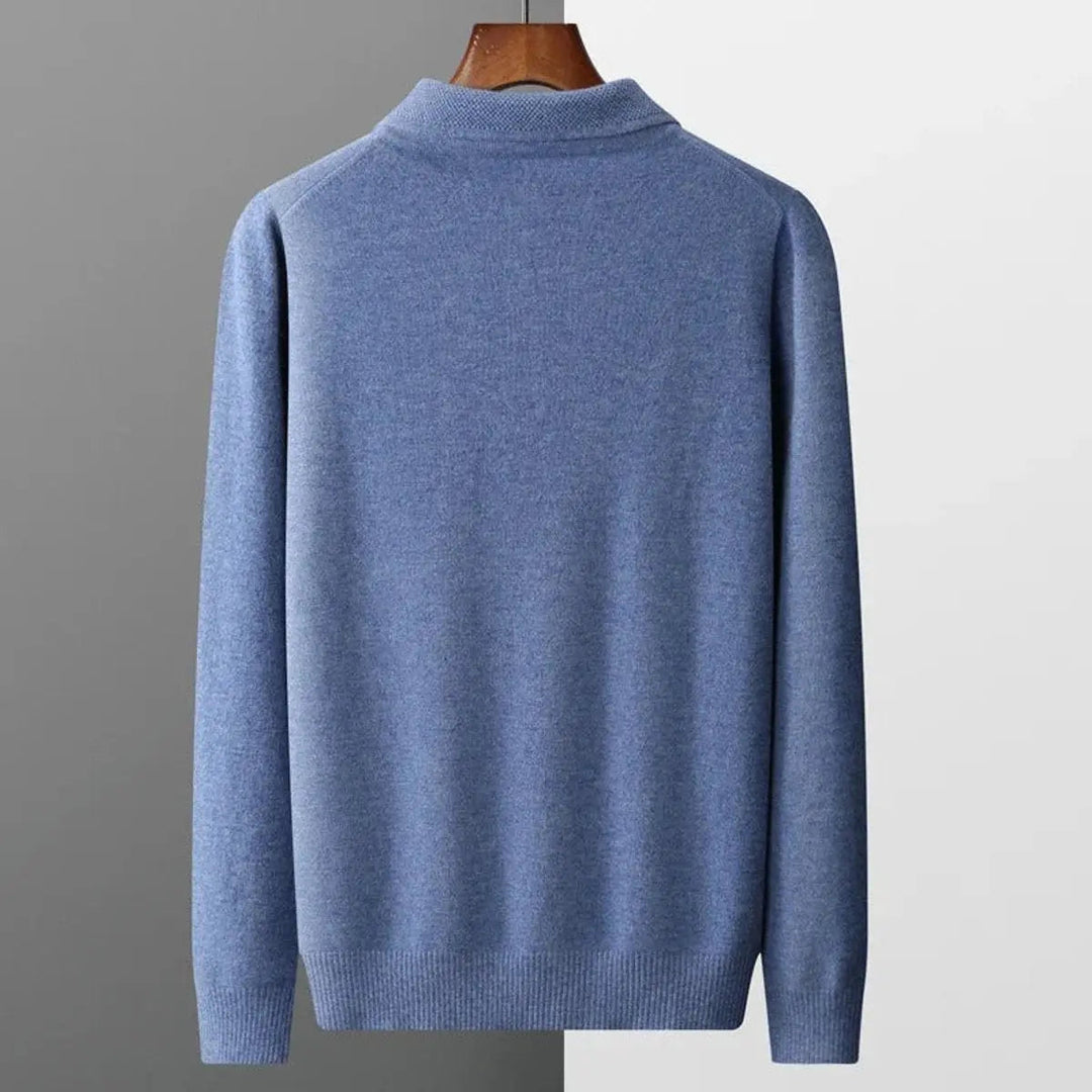Model wearing sophisticated men's long sleeve cashmere polo knit sweater, styled for business casual.