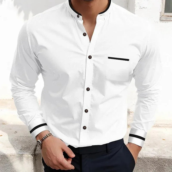 Detailed view of men's long-sleeve grandad collar shirt showcasing contrast trim and functional chest pocket.