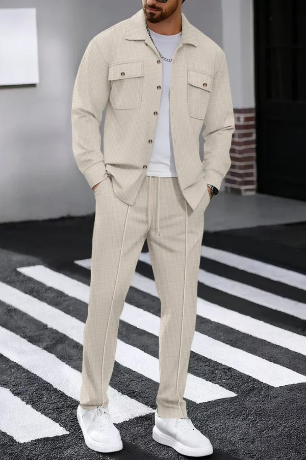 Stylish men's button-up overshirt and straight leg trouser outfit.