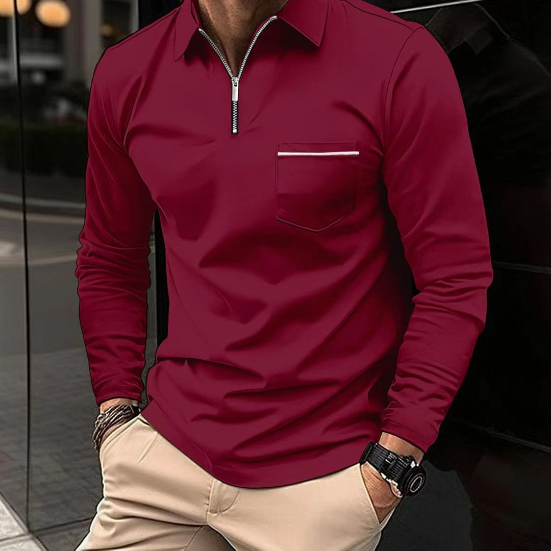 A man's hand adjusting the collar of a warm, stylish long sleeve polo shirt for smart casual fashion.