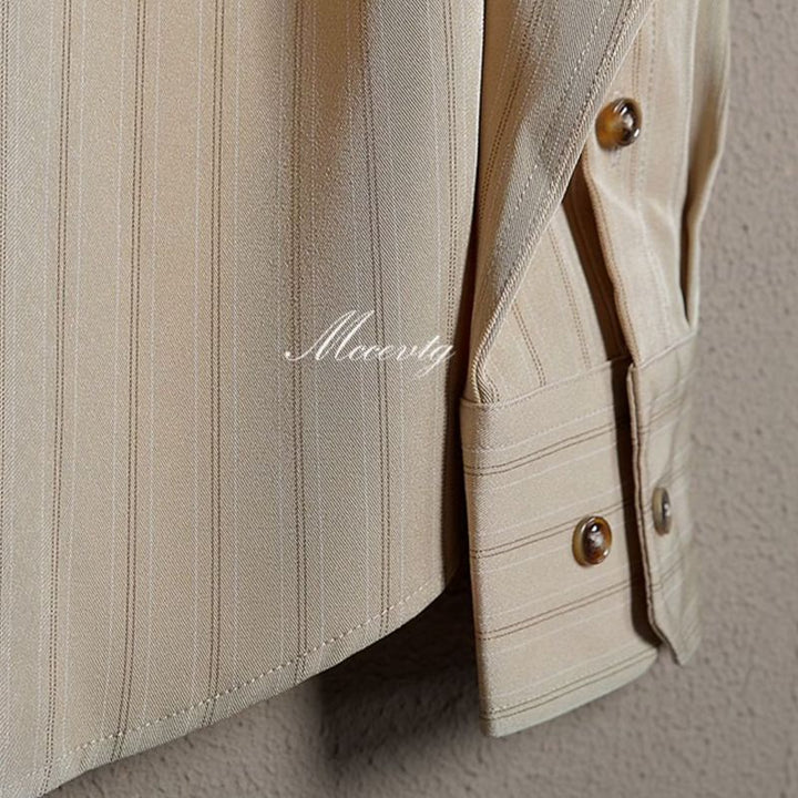 Comfortable men's striped long-sleeve button-up dress shirt, classic menswear with point collar.