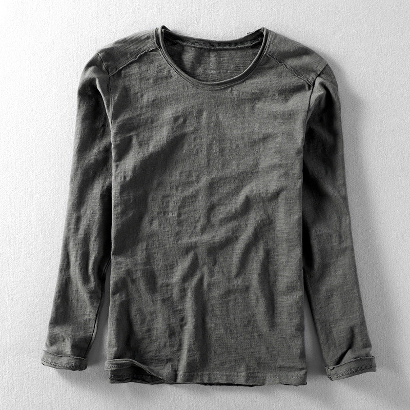 Man wearing a straight fit long sleeve textured crew neck shirt, showcasing its casual style for everyday fashion.