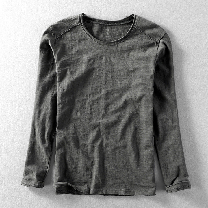 Man wearing a straight fit long sleeve textured crew neck shirt, showcasing its casual style for everyday fashion.