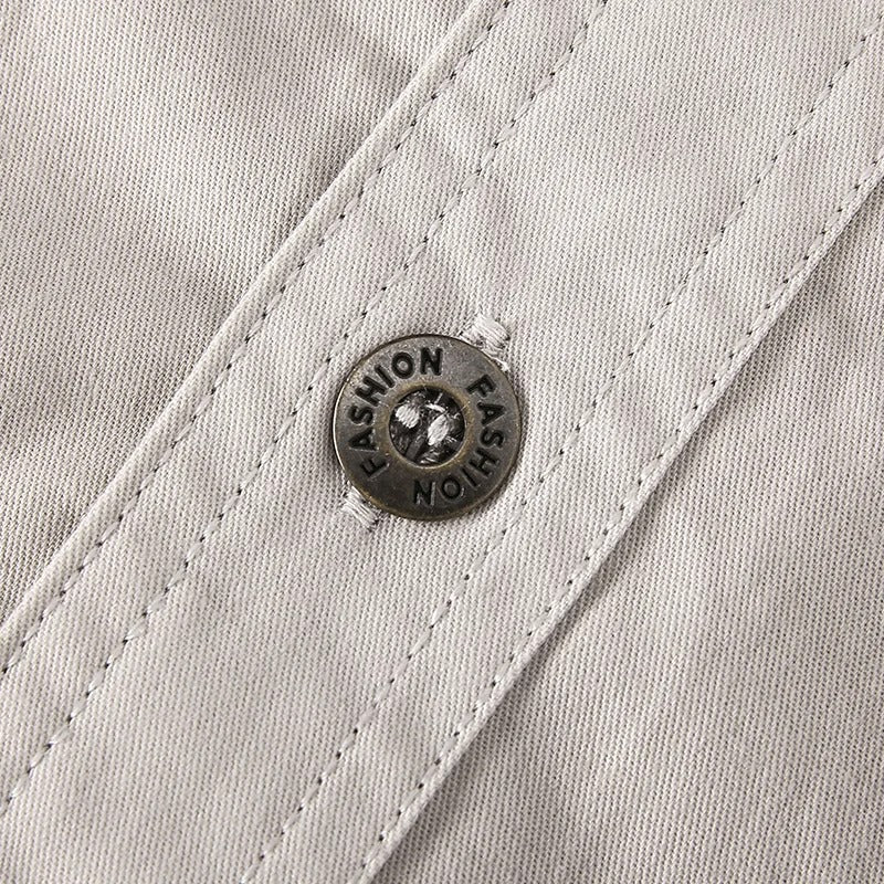 Comfortable men's long sleeve workwear shirt with chest & arm pockets, durable.