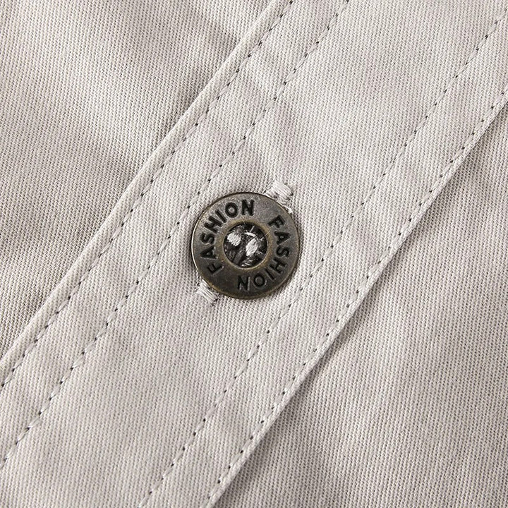 Comfortable men's long sleeve workwear shirt with chest & arm pockets, durable.
