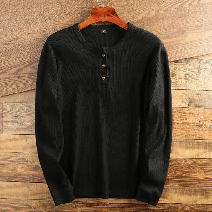 Man wearing a comfortable and versatile men's long sleeve waffle knit henley.