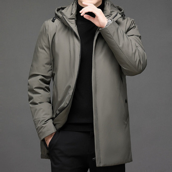 Stylish men's long winter coat with hood for ultimate warmth. Essential cold weather outerwear & casual fashion.