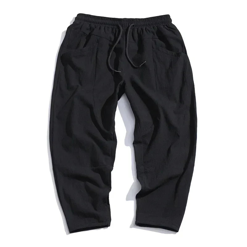 Comfortable men's cropped drawstring pants. Loose fit, ankle-length chinos for relaxed casual wear.