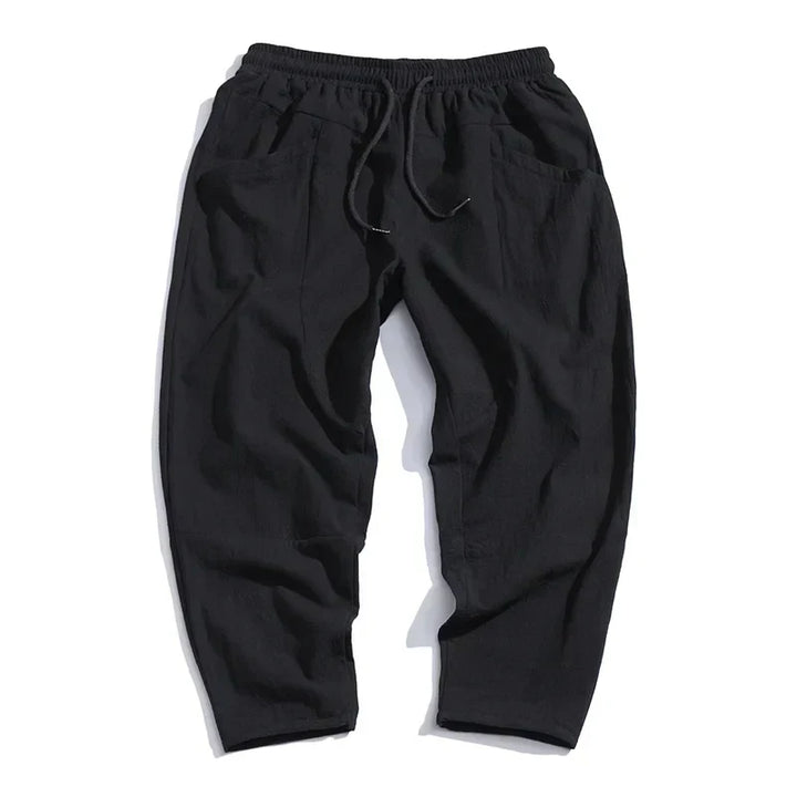 Comfortable men's cropped drawstring pants. Loose fit, ankle-length chinos for relaxed casual wear.