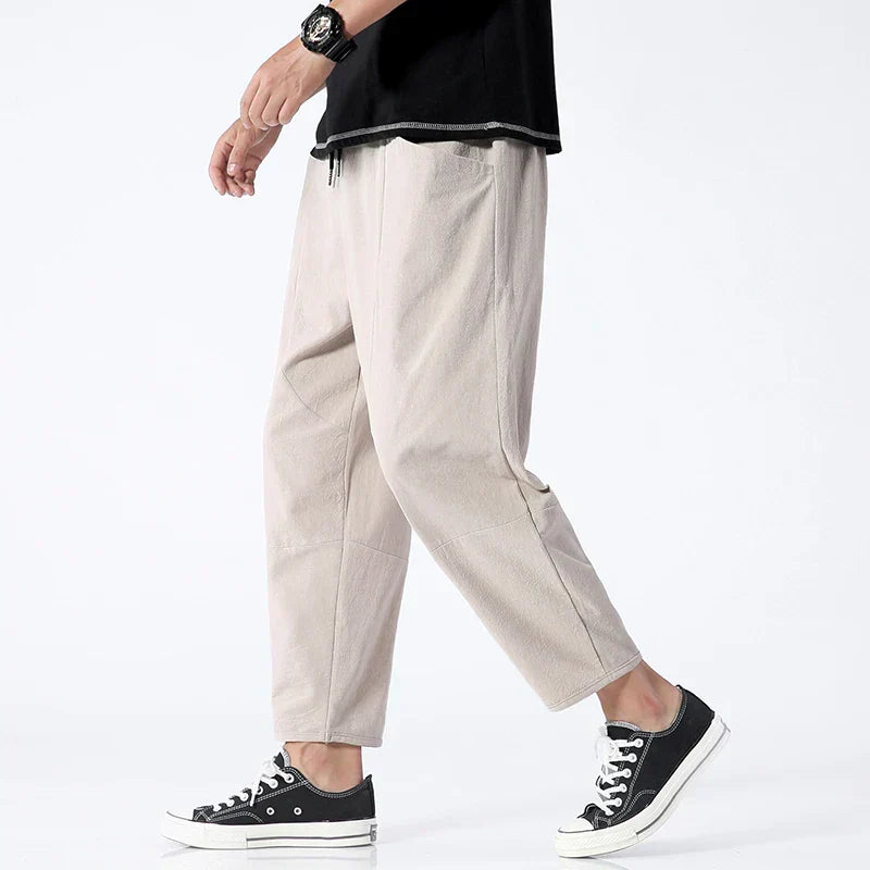Men's stylish cropped drawstring pants, loose fit. Ankle-length chinos ideal for summer casual fashion.