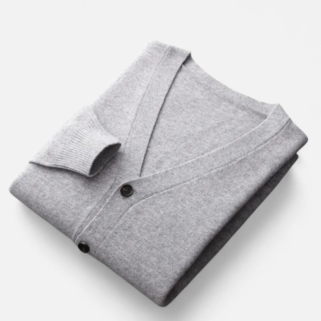 Man modeling loose V-neck cardigan, showcasing comfortable fit for casual & smart casual style.