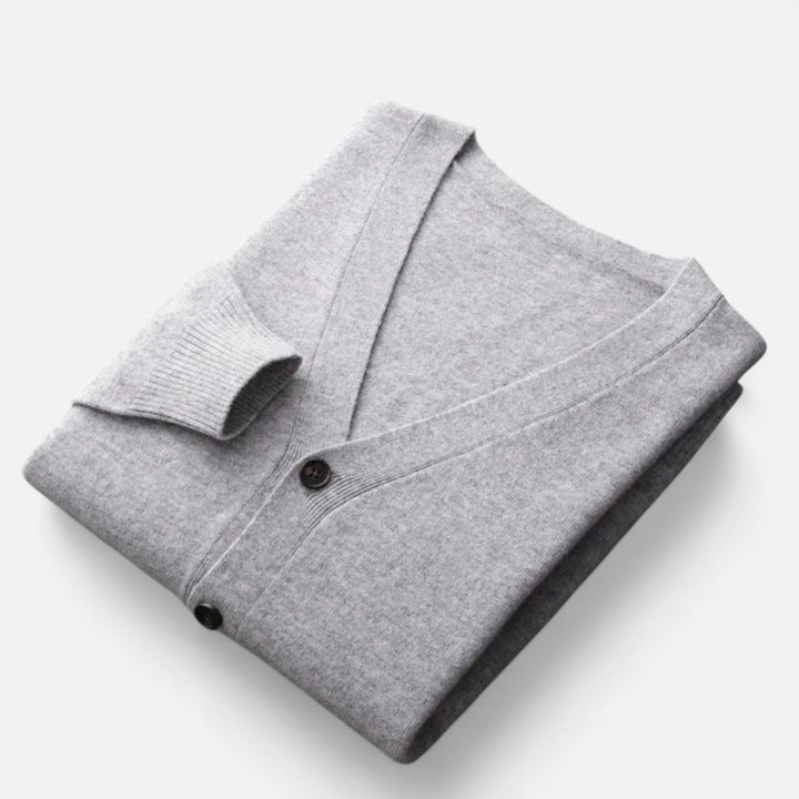 Man modeling loose V-neck cardigan, showcasing comfortable fit for casual & smart casual style.