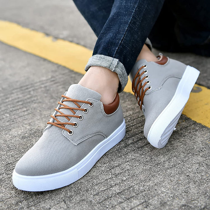 Dynamic shot of men's casual lace-up sneakers, showcasing flexibility and plush comfort features.