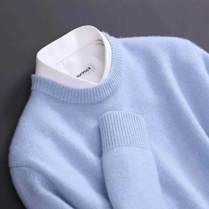 Close-up of the ultra-soft fabric on a men's luxurious long sleeve pullover jumper.