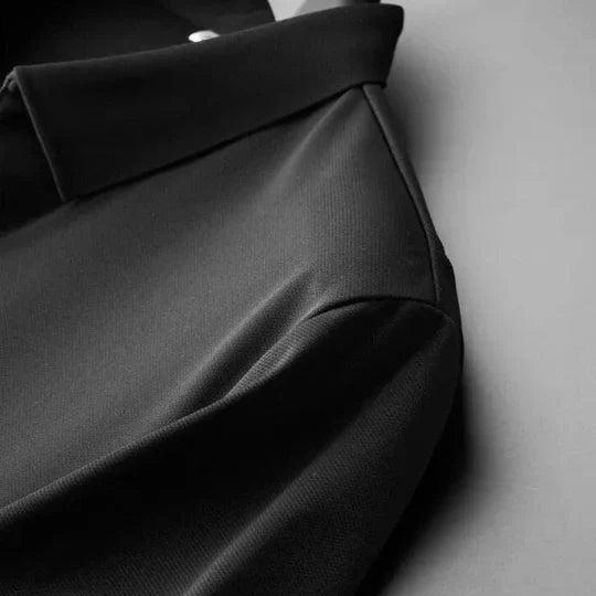 Neatly folded men's luxury cotton linen two-piece set, ready for travel or relaxed all-season wear.