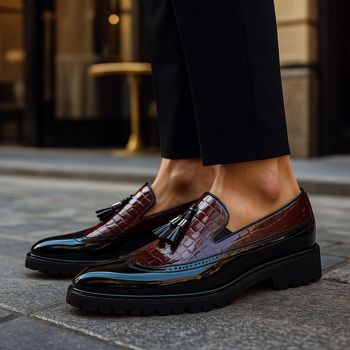 Fashionable men's luxury croc-embossed tassel loafers. Elegant formal slip-on dress shoes.