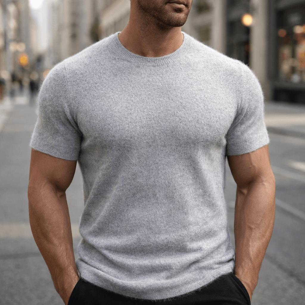 Close-up of a premium men's knitted crew neck t-shirt, showcasing the luxurious texture and smart casual style.
