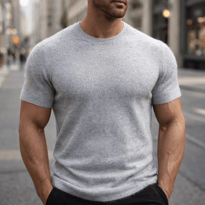 Close-up of a premium men's knitted crew neck t-shirt, showcasing the luxurious texture and smart casual style.