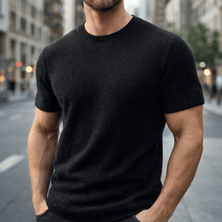 Stylish men's crew neck knitted t-shirt, short sleeve, creating an elegant, modern smart casual luxury look.