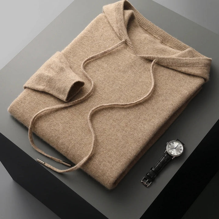 Close-up of the adjustable drawstring hood on a stylish men's luxury pullover hoodie, soft modern fabric.