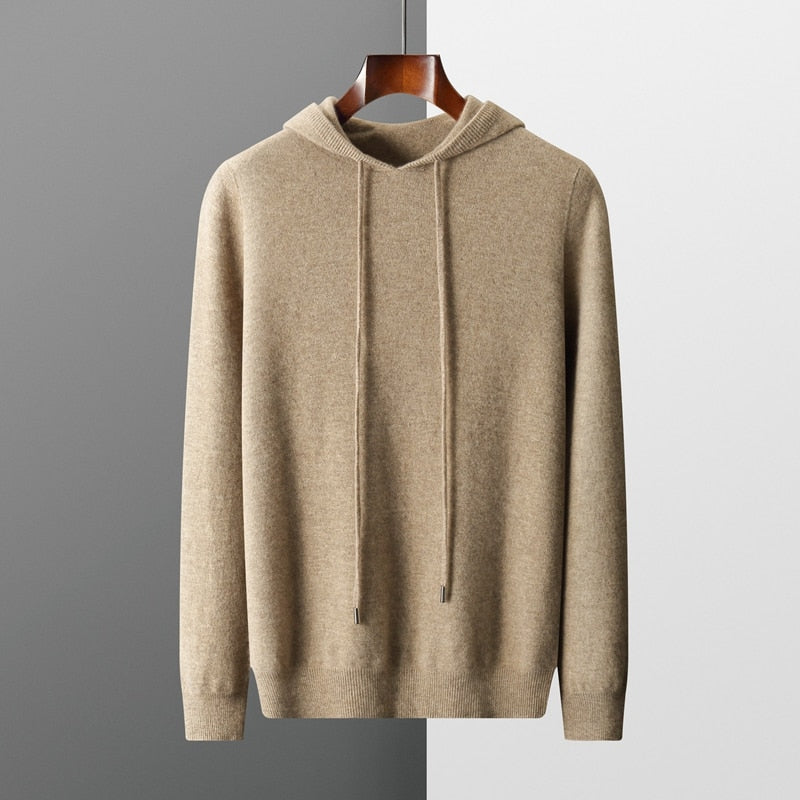 Model wearing a comfortable men's luxury pullover hoodie, modern look, adjustable drawstring hood, men's fashion.